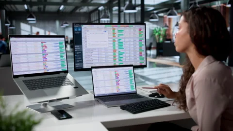 Medical Coder Reviews Billing Software Data Using Laptop Stock Footage 335459295