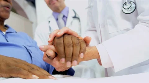 Medical Consultants Reassuring Patient Stock Footage