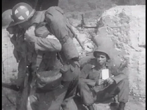 A medical core soldier delegates a task to help a distressed soldier to one of Video stock 75268257