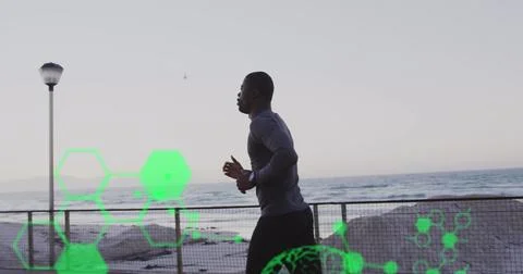 Medical data processing against african american fit man running on the 스톡 사진