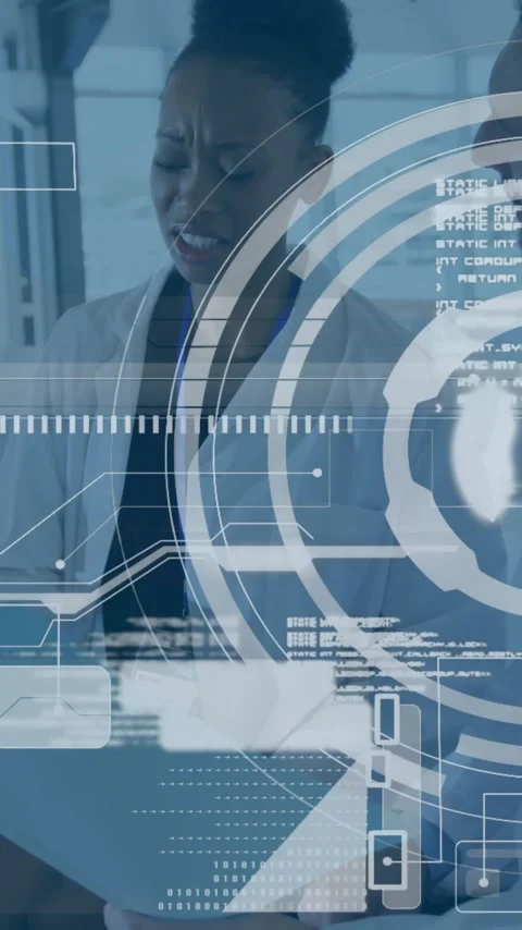 Medical data processing animation over healthcare professionals discussing in Stock Footage 343028683