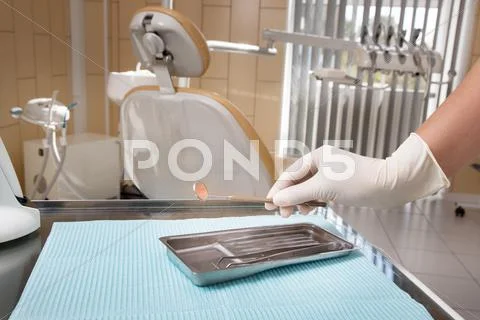 Medical dental instruments in the doctor's hands Stock Photos