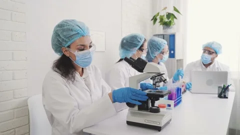 Medical Development Laboratory: Looking Under Microscope, Analyzes Sample Stock Footage 171630973