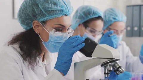 Medical Development Laboratory: Looking Under Microscope, Analyzes Sample Video stock 171666238