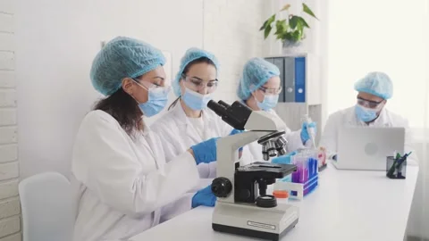 Medical Development Laboratory: Looking Under Microscope, Analyzes Sample Stock Footage 171669474