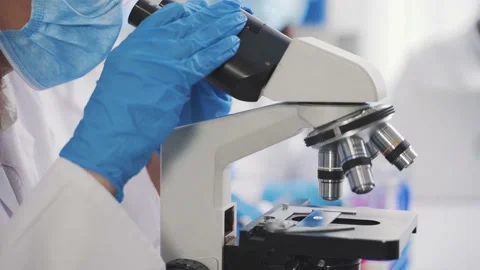 Medical Development Laboratory: Looking Under Microscope, Analyzes Sample Stock Footage 171729117