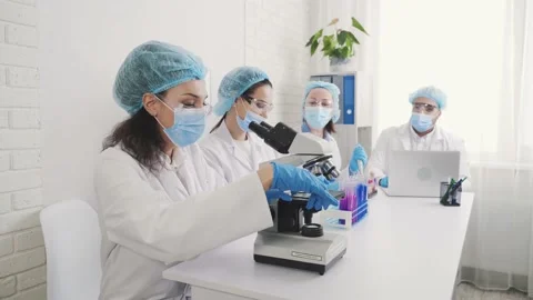 Medical Development Laboratory: Looking Under Microscope, Analyzes Sample Stock Footage 171729649