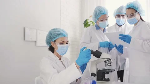 Medical Development Laboratory: Looking Under Microscope, Analyzes Sample Stock Footage 171815283