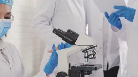 Medical Development Laboratory: Looking Under Microscope, Analyzes Sample Stock Footage 171855194