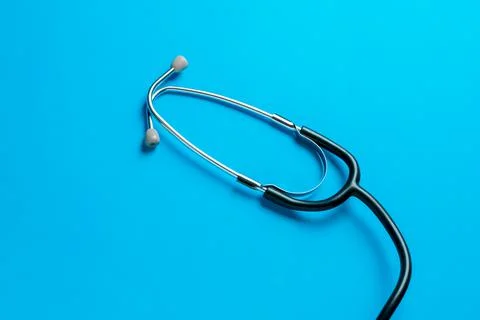 Medical device stethoscope on a blue background. Stock Photos