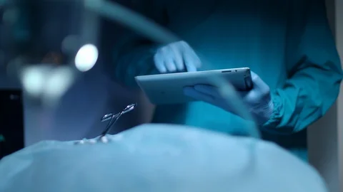 Medical diagnostics technology. Surgery hand use tablet computer Stock Footage 95329686