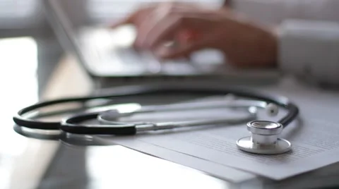Medical doctor typing on computer Stock Footage 59911068