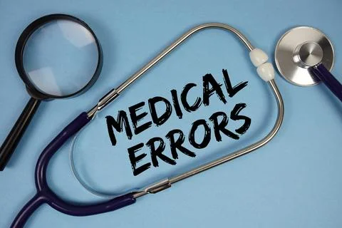 Medical Errors text with Stethoscope and magnifying glass on blue background Stock Photos