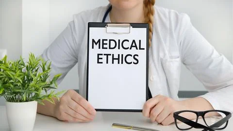 Medical Ethics text with document brown envelope and stethoscope isolated o.. Stock Photos