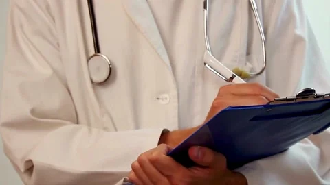 Medical form doctor is making notes in the patient's medical record. and asthma Видео 336587697