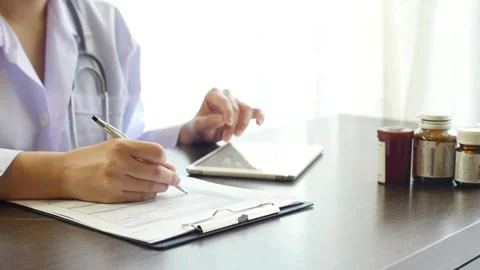 Medical form doctor is making notes in the patient's medical record. and asthma Stock Footage 336587734