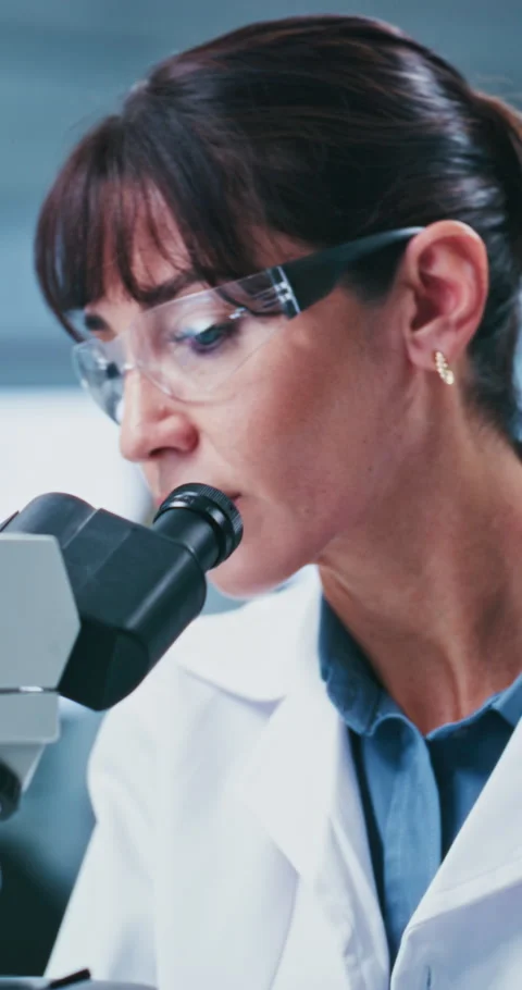 Medical, goggles or scientist in lab with microscope, test or examination in Stock Footage 331529778