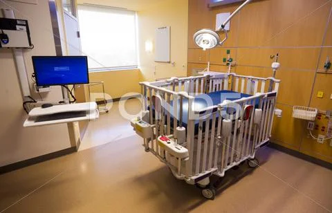 Medical Inspection Light Shines Down Bed Childrens Hospital Room