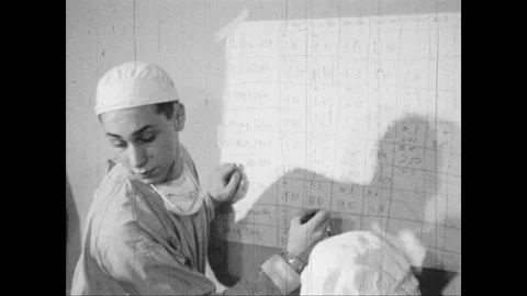 Medical Intern writes on a board Stock Footage 109558228