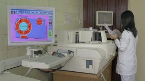 Medical lab worker loading data, touch screen,computerized laboratory equipment Stock Footage 59101435