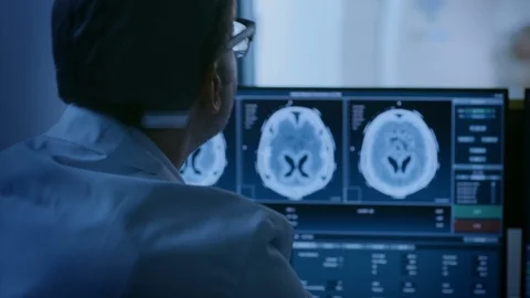 In Medical Laboratory Patient Undergoes MRI or CT Scan Process, in Control Room Stock Footage