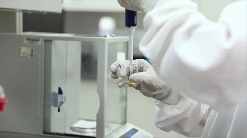 Medical Laboratory Technician Using Autoclavable Pipette To Transfer Liquid Stock Footage 109635640