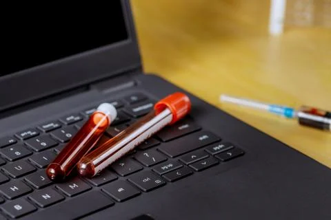 Medical in laboratory working on computer test blood tubes office of hospital Stock Photos