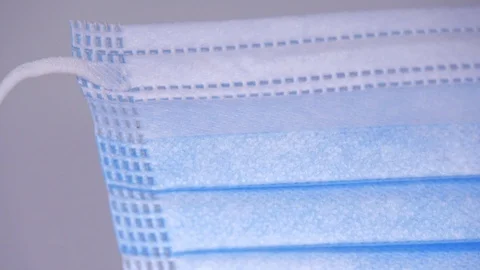 Medical mask, close up, slide down Stock Footage 129607210