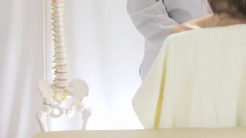 Medical massage of the upper spine while sitting Stock Footage