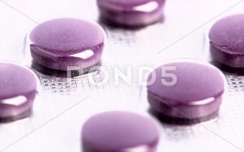 Medical pills as abstract backgrounds with shallow focus Stock Photos