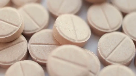Medical pills placed on rotating table, close up Stock Footage 84847609