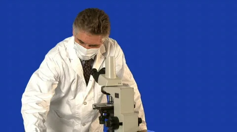 Medical professional looking through a microscope  Stock Footage 641333
