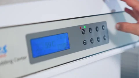 Medical professional operating digital control panel on lab equipment durin.. Stock Footage 337682892