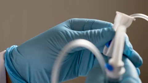 Medical Professional Preparing an IV Drip Stock Footage 313187342