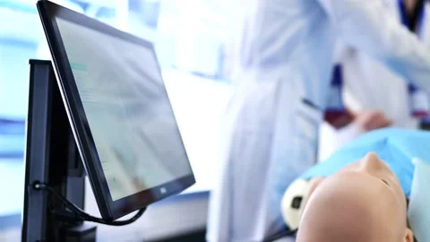 Medical professionals learning with patient simulation technology during Stock Footage 323377921
