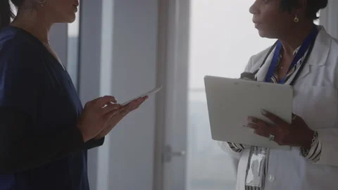 Medical Professionals Talking Over Notes... | Stock Video | Pond5