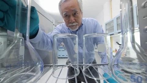 Medical research scientists taking instruments from the sterilisation machine. Stock Footage 94060330