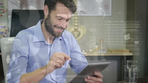 Medical researcher using tablet in lab, streaming animated pelvis model and Stock Footage 307465344