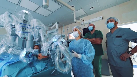 Medical robot. Robotic Surgery. Manipulators performing surgery on a man Stock Footage 121420053