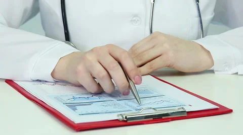 Medical scientist doing research, comparing graphs, statistics. Data analysis Stock Footage 60839855