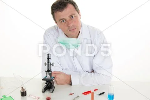 Medical Scientist Working In Modern Lab, Research With Tubes And Notebook