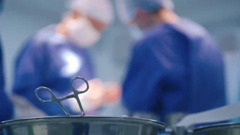 Medical scissors on blurred surgery process background. Stock-Footage 127218643