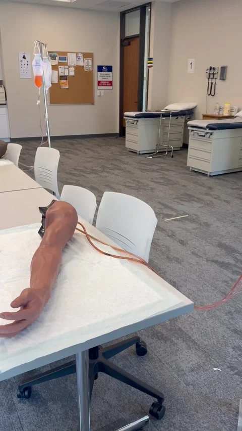 Medical Simulation Arm in Classroom Setting Stock Footage 344593633