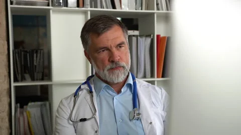 Medical specialist working with computer typing sitting at desk in clinic office Stock Footage 161327708