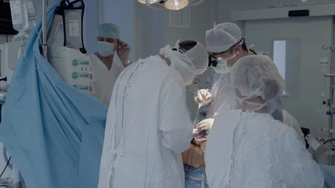 Medical staff of the operating unit do heart surgery Stock Footage 104923235