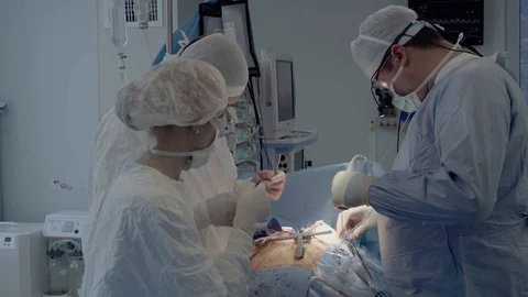 Medical staff of the operating unit do heart surgery Video stock 104923319