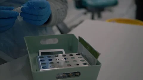 Medical staff using Covid testing equipment 스톡 동영상 148499285