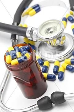 Medical stethoscope and capsule Stock Photos