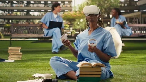 Medical student adjusting virtual reality headset during outdoor learning Stock Footage 340961003
