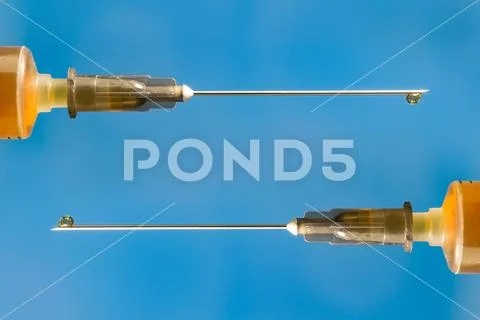 Medical syringe needle close-up with space for signature Stock Photos